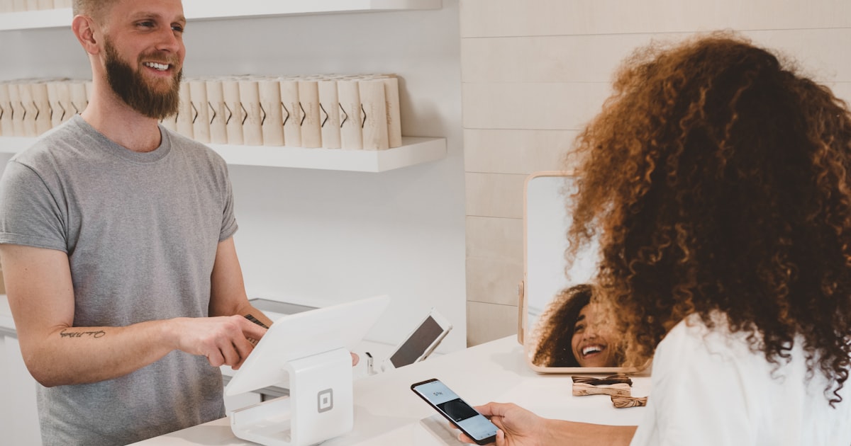 Canadian business owner inside their workplace preparing loan documentation