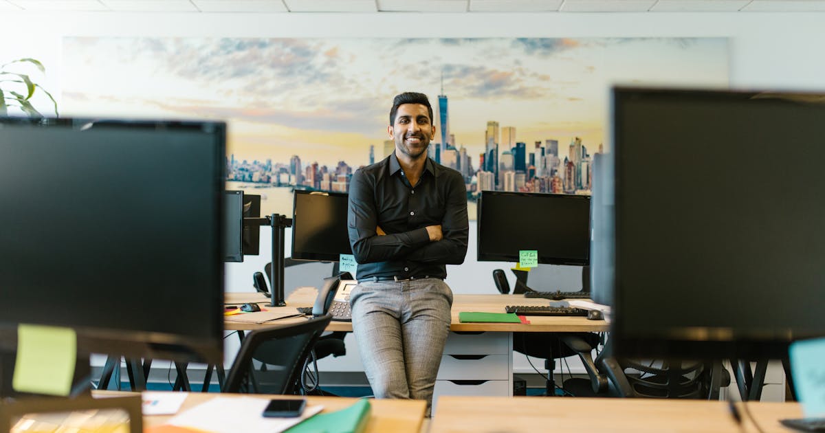 Business owner thoughtfully evaluating coverage options at a modern office desk